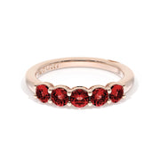 Round Cut Ruby Eternity Band in 18kt Rose Gold