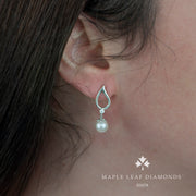 Boucles d'oreilles pendantes en perles et diamants canadiens