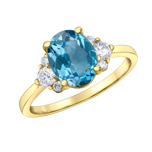 Bague avec topaze bleue taille ovale et diamants canadiens