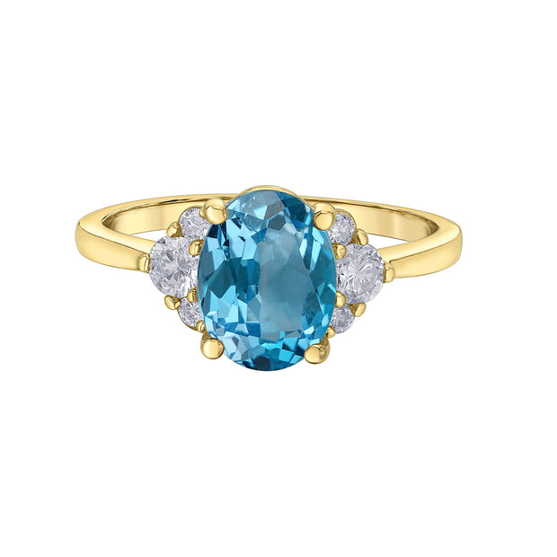 Bague avec topaze bleue taille ovale et diamants canadiens